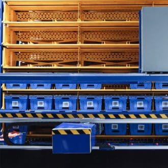 Home 7 Storix multi-zone climate rack with blue totes arranged for ambient, chilled, and frozen item storage.